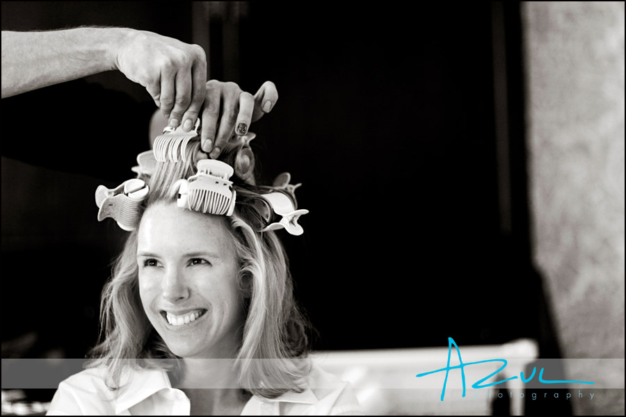 The bride laughs as the photographer snaps a photo befor the Chapel Hill wedding.