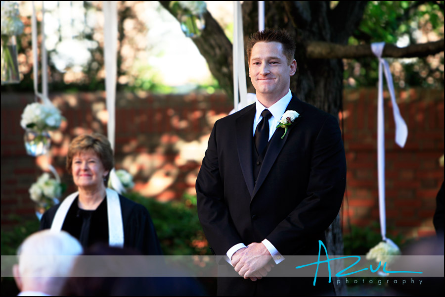 Jeff looks at his bride walk down the Carolina Inn aisle in Chapel Hill.