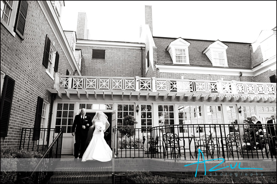 The father of the bride walks his daughter down the aisle in Chapel Hill.