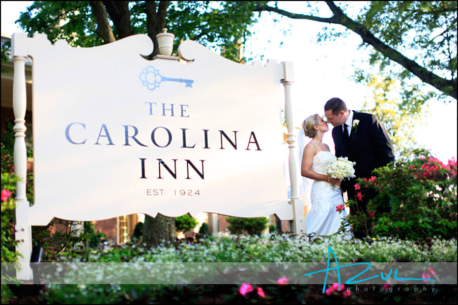 Bride & groom at the Carolina Inn sign.