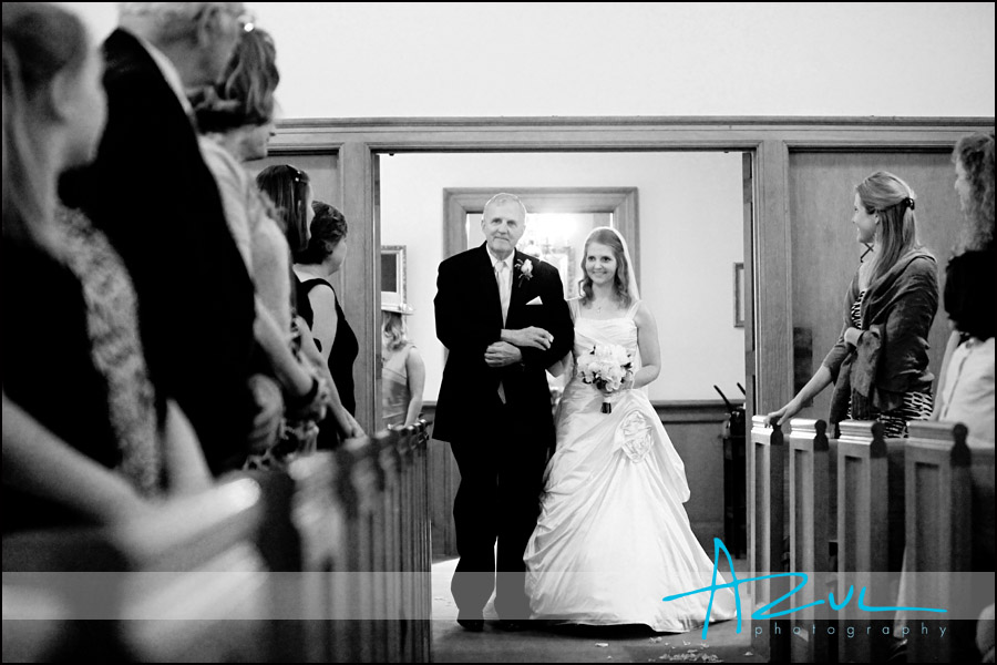 Photographic Moment of Bride walking down the aisle