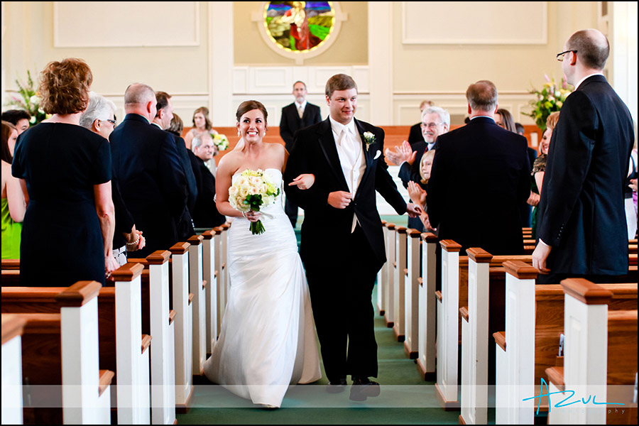 Wedding ceremony ending photograph of Raleigh bride & groom