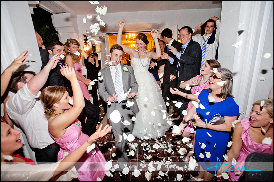 Fun wedding day exit from reception photography Raleigh NC