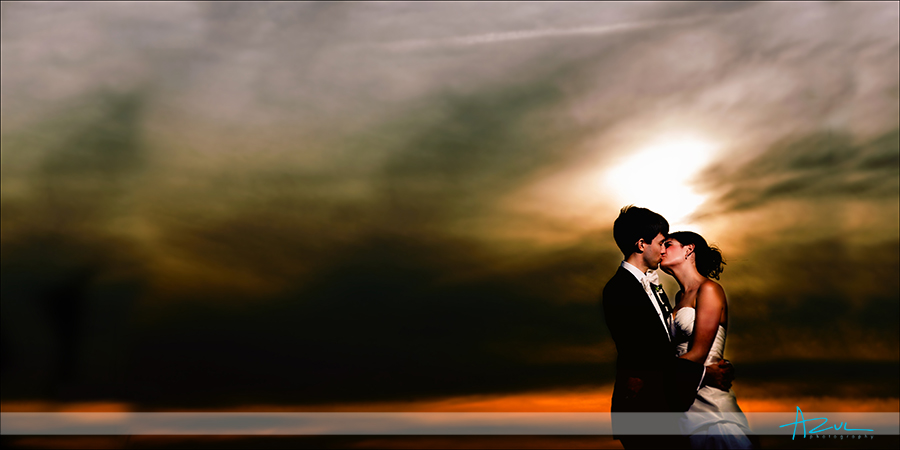 Outer Banks NC Whalehead Club kiss at sunset wedding photographer