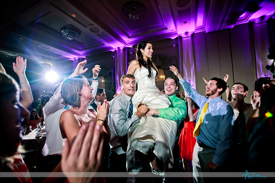 High energy wedding day dancing photography  in the ballroom of Prestonwood CC in Cary NC