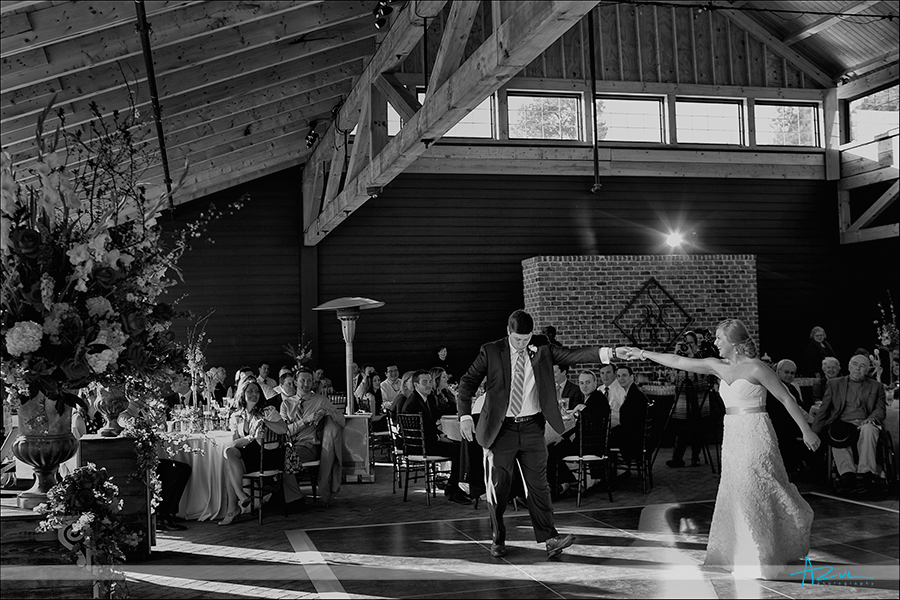 First dance moment of bride and groom on the dance floor at The sutherland NC