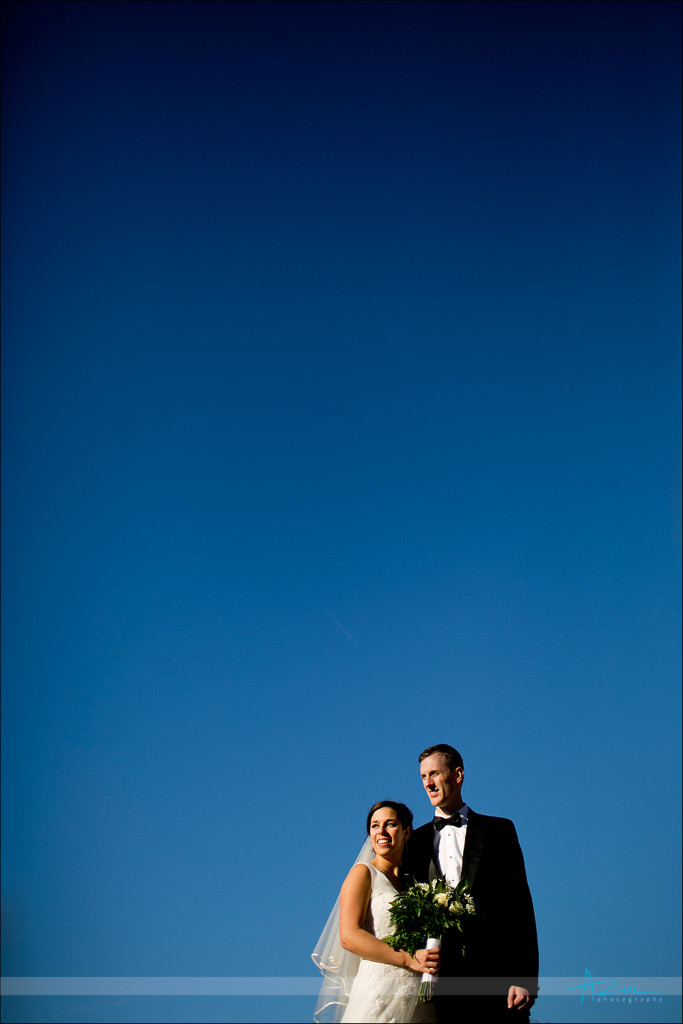 Wedding day Carolina blue skies with bride and groom portrait photographer