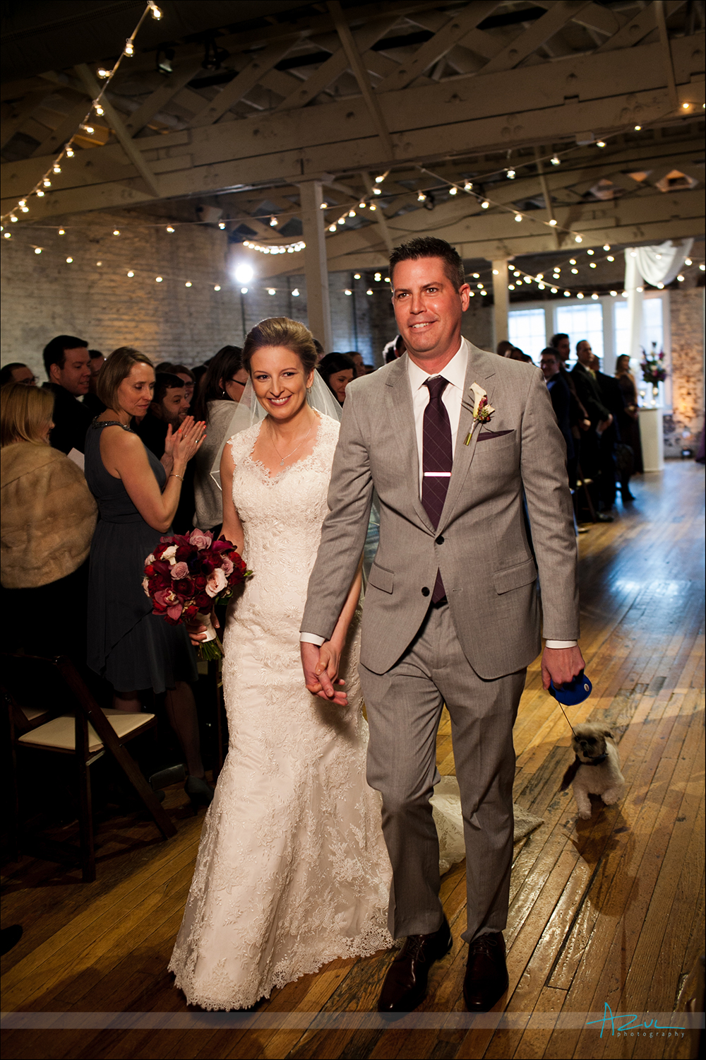 End of ceremony photograph of bride and groom at The Stockroom in Raleigh
