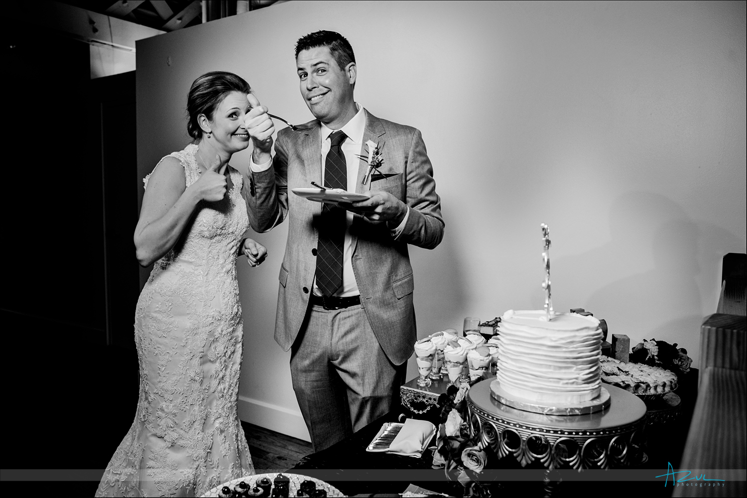Cute wedding day cake cutting photograph at The Stockroom in Raleigh, North Carolina