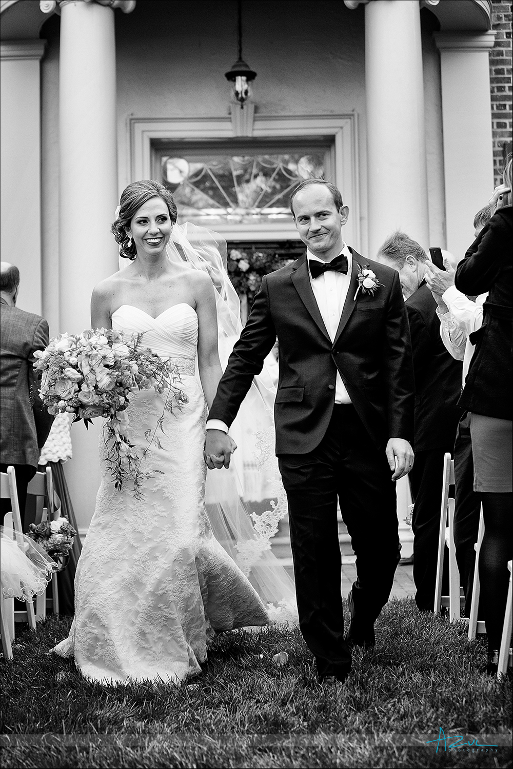 Husband and wife walking down the aisle after wedding in Chapel Hill NC