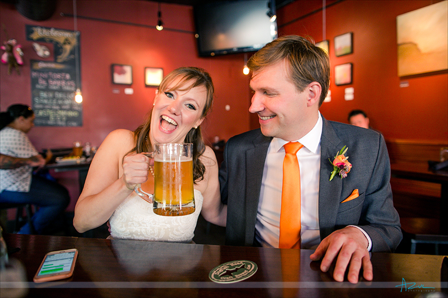 Best way to have a good time at a wedding is having a beer prior. This photograph is the bride and groom sharing a beer.