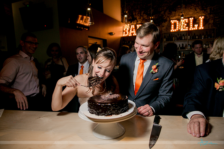 Best cake cutting photograph of the bride devouring cake on her wedding day.