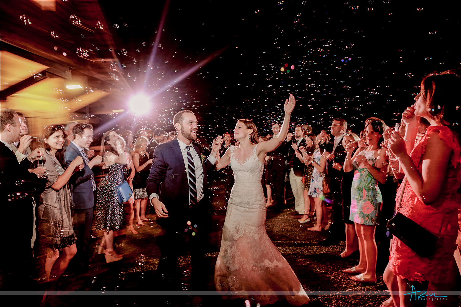 Wedding day bubble exit moment captured perfectly by the documentary photographer in Raleigh NC