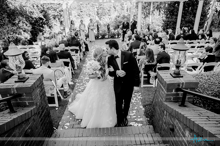 Sharing a kiss down the aisle is also a photographer favorite image to create in North Carolina.