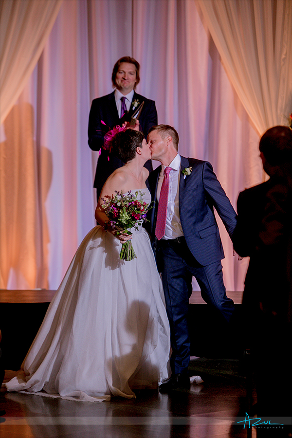 Wedding day ceremony kiss perfectly captured by the photographer at 21c in Durham