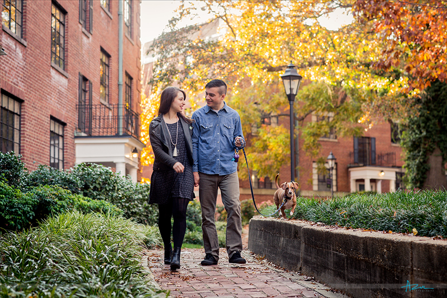 The couple walking together during their engagement portrait session