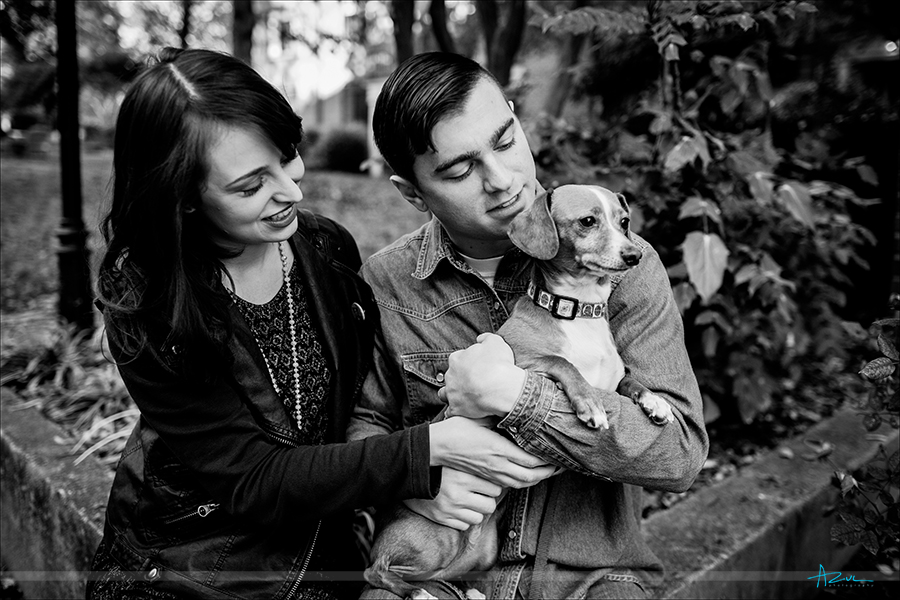 The wedding couple and their dog during the engagement portrait session in Raleigh, NC