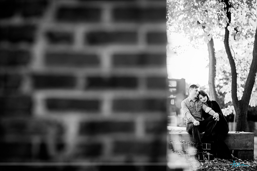Rustic urban engagement photography portrait session with emotion of couple in downtown Raleigh