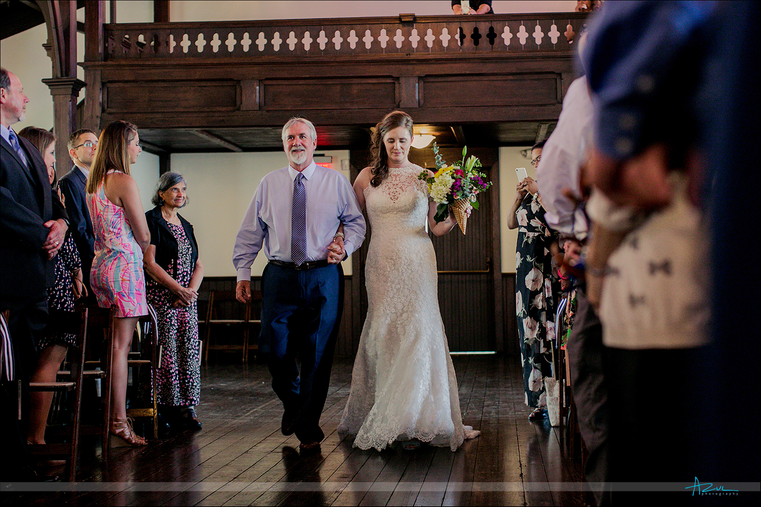 Beautiful photography of the bride walking down the aisle for a wedding at All Saints Chapel in Raleigh NC