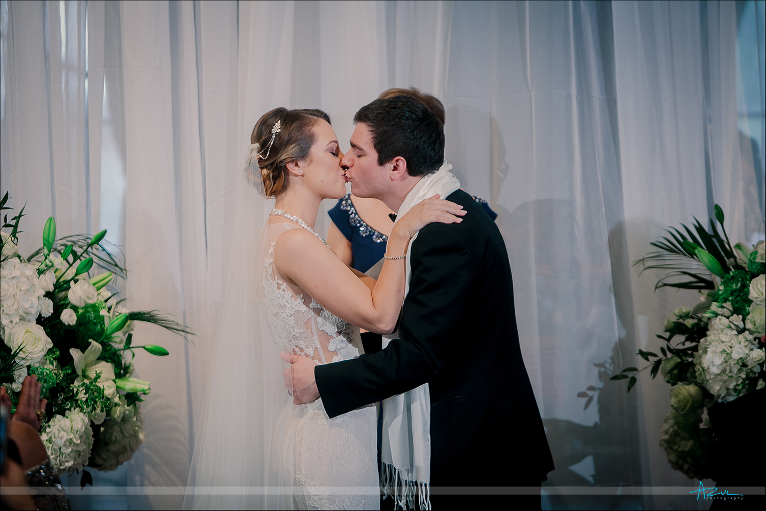 Wedding ceremony kiss of the bride and groom at 21c Museum & Hotel