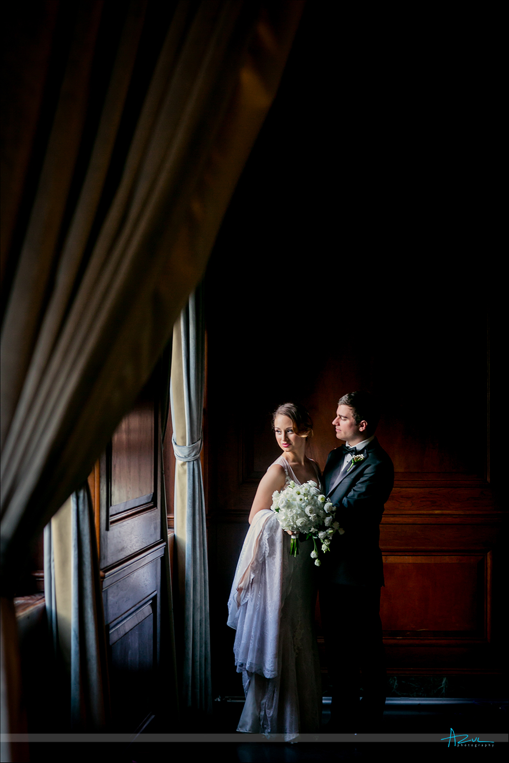 Window light portrait of bride and groom on the wedding day in Durham NC